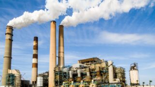 photo of an industrial factory emitting smoke